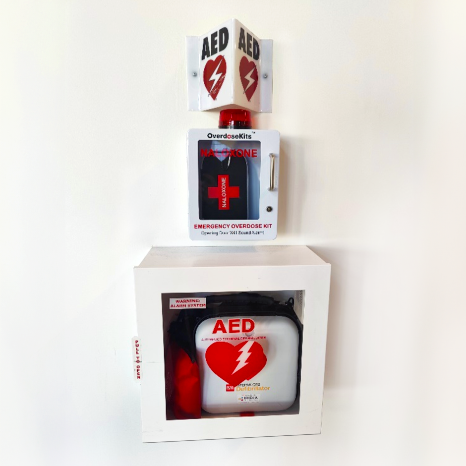 An AED and naloxone kit affixed to the wall.